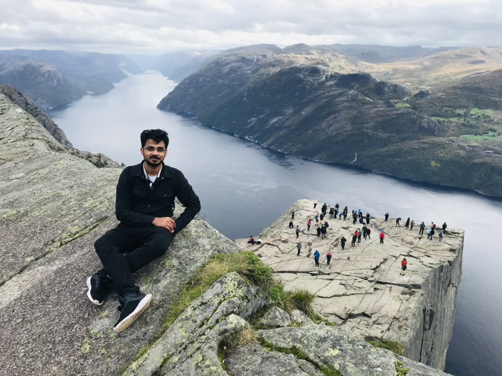 Abdul Manaf in the Norwegian mountains above a fjord
